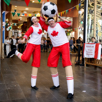 vancouver stilt walker playing soccer